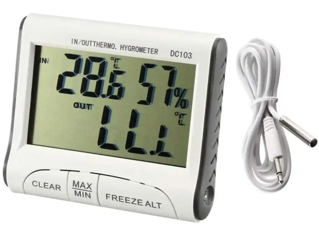 Termohigrómetro in out modelo DC103 con la sonda desconectada y enrollada colocada a su lado derecho